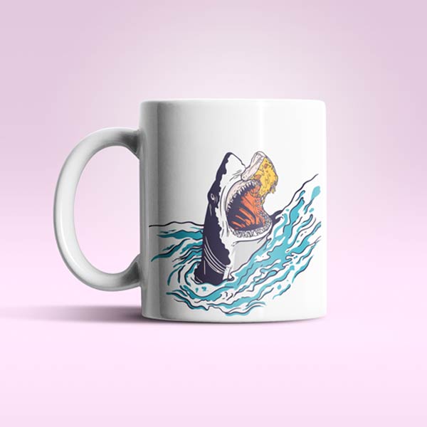 A digitally printed mug with a shark design